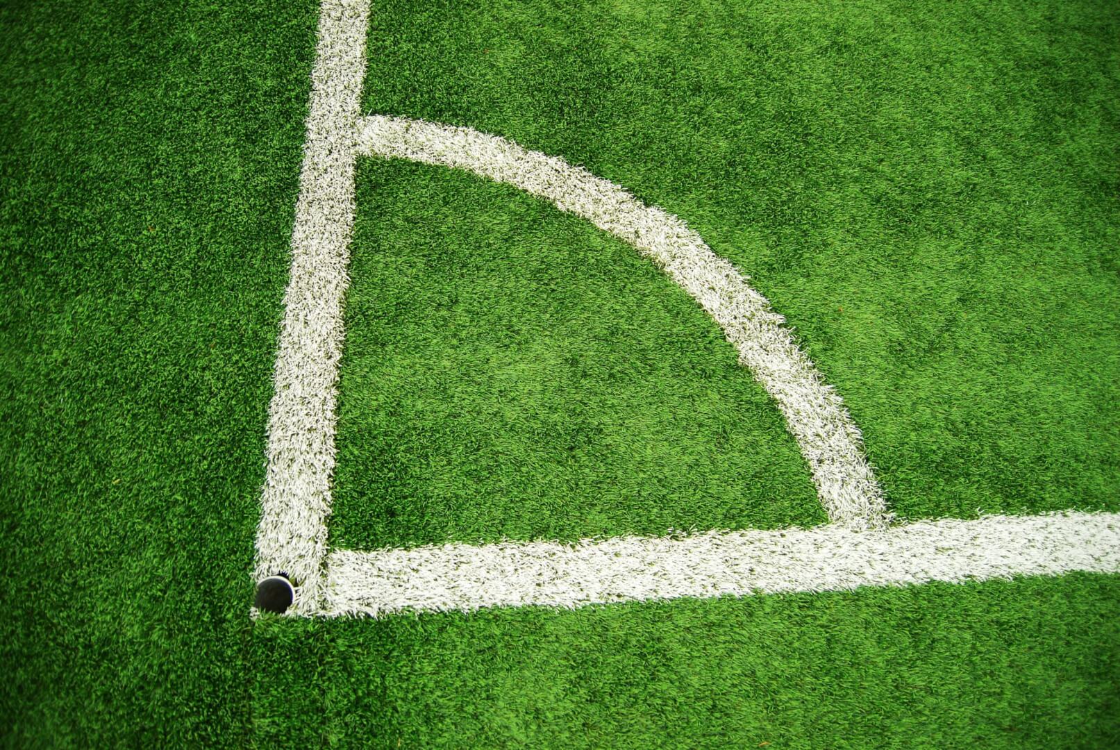 green and white football pitch